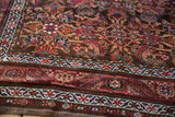 Antique Northwest Persian rug's hand-knotted pile detail: Herati pattern, dark chocolate and wine red borders.