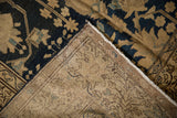 Hand-knotted vintage Malayer rug with navy blue floral pile and intricate woven foundation.
