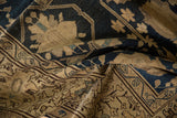Hand-knotted Malayer rug featuring navy field, beige blossom motifs, and intricate border detail.