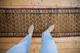 Hand-knotted Northwest Persian runner featuring repeating boteh in a rainbow palette.