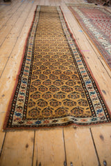 Intricate side border and allover vibrant boteh pattern on antique Northwest Persian runner.