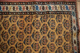 Antique Northwest Persian rug border with colorful geometric pattern and gold boteh field.