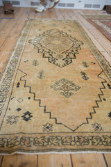 Distressed vintage Senneh Baft runner, showing diamond medallion and geometric plants.
