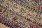 Detail of antique Kermanshah runner's ivory, navy, and blush floral, vine borders.