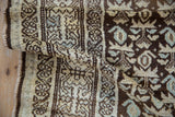 Distressed Kurdish Hamadan runner with variegated pile and chocolate brown plant motifs.
