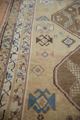 Distressed Caucasian runner's abrash texture with sand, sky blue, and brown geometric patterns.