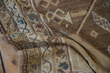 Close-up of vintage distressed Caucasian runner showing worn textured pile and geometric motifs.
