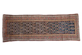 Antique Kurdish rug runner with repeating botehs on a field of chocolate brown and deep cobalt blue.