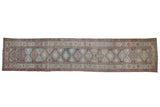 Distressed vintage Persian Hamadan runner, geometric guls in muted blues, blush, and ivory.