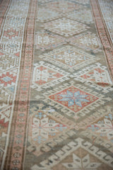 Textural distressed Hamadan runner: blush checkered floral border, blue and ivory hook-latch diamond guls.