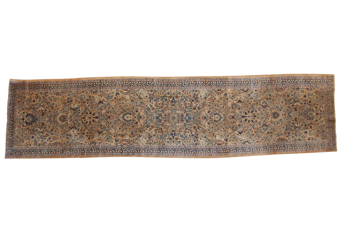 Vintage tea-washed Meshed runner with a floral and paisley design in camel, blue, and brown.