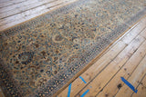 Angled perspective on the vintage tea washed runner, showing its long proportion and intricate pattern.