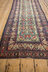 Antique Kermanshah detail: ivory field with nuanced Shadow Samovars and complex navy border.