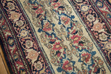 Antique Persian Kermanshah rug detail: shadow samovars, vinery, blossoms in cochineal red, navy, and ivory.
