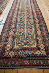 Antique Kermanshah runner: stylized Samovars and blossoms on ivory field with navy and cochineal red borders.