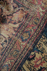 Expertly in-seamed borders of the antique Kermanshah runner, revealing vinery, blossoms, and muted abrashes.