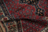 Close-up of the vintage Kurdish rug runner's flexible body, highlighting its short, dense wool pile.