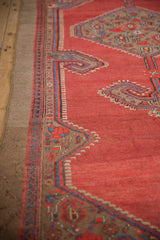 Intact side cord selvage on a vintage Serab runner with red, blue, and camel geometric borders.