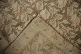 Distressed vintage Karabagh runner's worn pile texture, faint foundation, and blush tones.