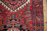 Vintage Heriz runner border: serrated red, blue patterns, and intact selvage.