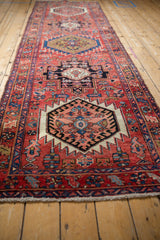 Blush serrated hexagonal medallion outlined in ivory, with sapphire blue and cherry red patterns.