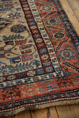Vintage Northwest Persian rug fringe and rust, blue, sand serrated leaf main border.