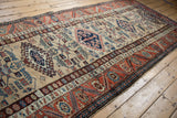 Patterned rust border and deep blue selvage of the vintage Northwest Persian rug.