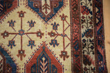 Close-up of wear to the knot heads on a Northwest Persian carpet's panel design.
