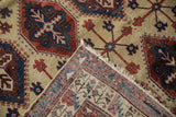 A folded corner of a vintage Persian carpet reveals the panel design and its hand-knotted back.