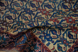 Textured hand-knotted pile of an antique Afshar rug with a floral lattice in saffron, blue, and red.