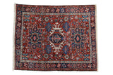 Vintage Karaja square rug with a triple center medallion and geometric floral designs in red, blue, and ivory.