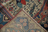 Vintage Malayer rug corner with bird motifs, red selvage, and visible hand-knotted foundation.