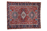 Vintage Persian Karaja rug, cherry red field, triple medallion, geometric leaves and blooms.