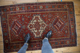 Vintage Karaja rug, triple diamond and hook-and-latch medallions, deep cherry red field.