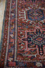 Vintage Karaja rug's intact navy blue side cord and geometric red, blue border.