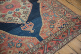 Traditional Malayer rug corner, serrated dusty navy blue and madder red spandrel.