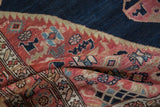 Vintage Malayer rug detailed meandering vine border and stylized bird motifs.