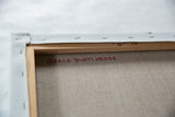 Artist's red signature on the back of Grace B. Keogh's canvas painting.