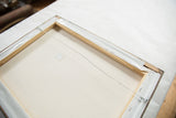 Reverse of Grace B. Keogh painting with light wooden frame and hanging wire.