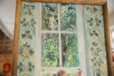 Grace B. Keogh painting detail: floral wallpaper and bright green foliage.