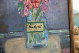 Canvas texture detail of blue vase, light brown surface, and pink artist signature.