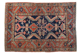Vintage Heriz rug with geometric double medallion and serrated motifs in navy, terracotta, 3'1