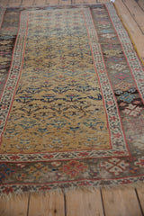 Antique Kurdish Bijar rug: ochre yellow field, allover henna plant motif, showing mostly even wear.