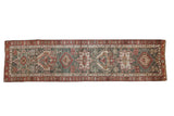Vintage 1940s Northwest Persian runner rug with geometric medallions in dusty teal and chestnut red.