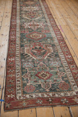 Textured multi-medallion and floral pattern of the vintage Northwest Persian runner in dusty teal and chestnut.