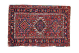 Hand-knotted Vintage Karaja rug, triple geometric medallions, cherry red field, colorful borders.