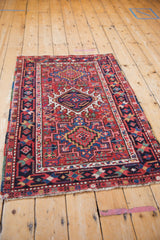 Starburst floral main border and geometric blossoms on a vintage Karaja rug with newer side selvage.