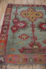 Turkish Kilim detail: saffron yellow diamonds, black cherry red plant motifs, seafoam green abrashes.