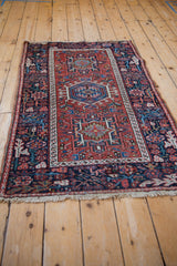 Angled view of the vintage Karaja rug, displaying its full length and rich, geometric pattern.