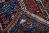 Hand-knotted foundation and weave detail on the reverse side of a vintage Persian Karaja rug.